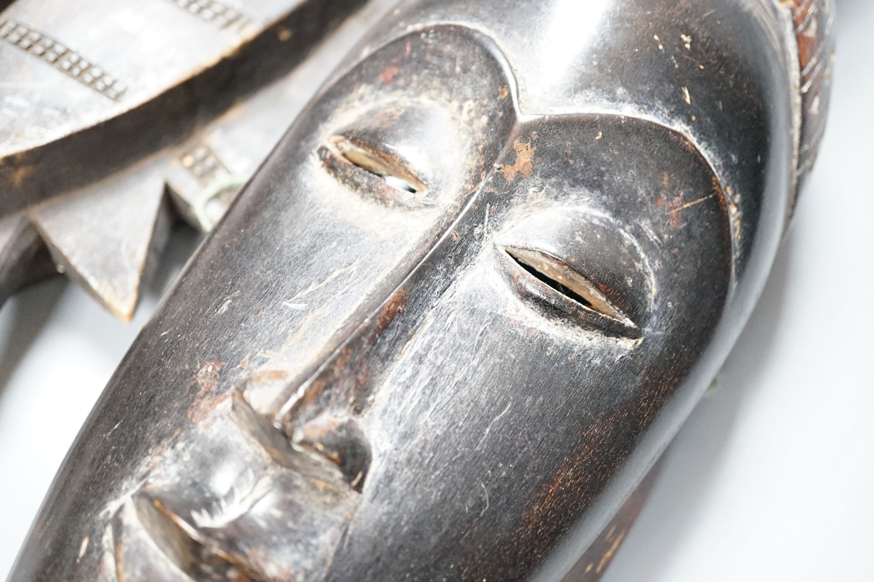 Two African carved wood masks; Senufo and Baule 65cm
